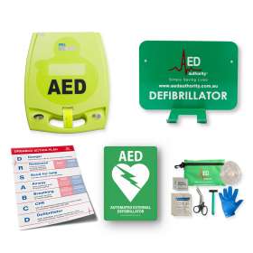 Photo of ZOLL AED with wall bracket and sign